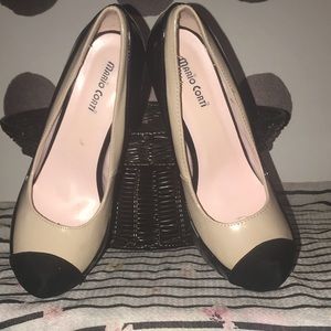 Cream and black stiletto pumps.
